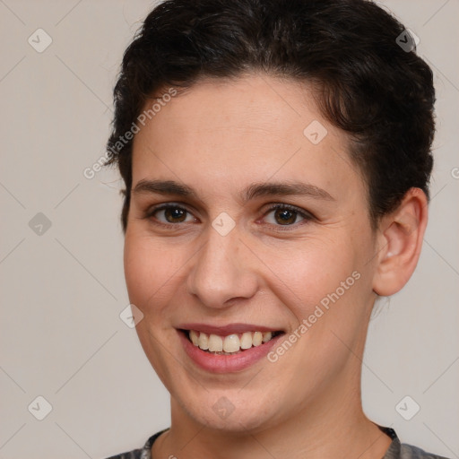 Joyful white young-adult female with short  brown hair and brown eyes