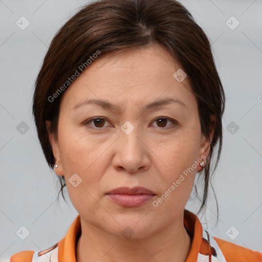 Joyful white adult female with medium  brown hair and brown eyes