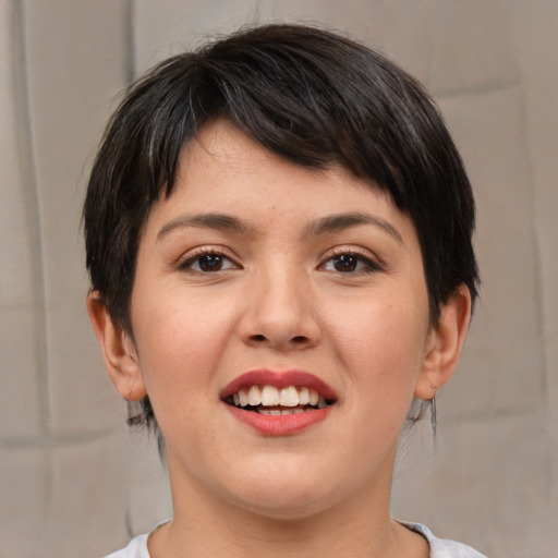 Joyful white young-adult female with medium  brown hair and brown eyes