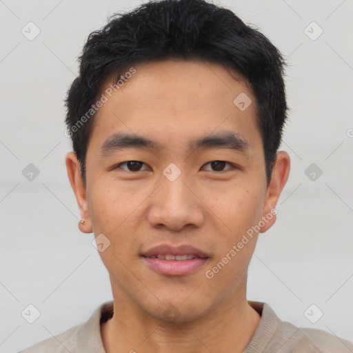 Joyful asian young-adult male with short  black hair and brown eyes