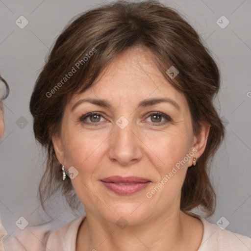 Joyful white adult female with medium  brown hair and grey eyes