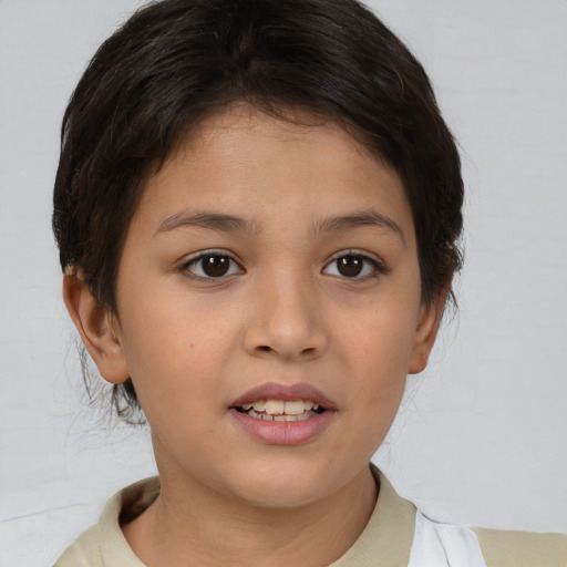 Joyful asian child female with short  brown hair and brown eyes