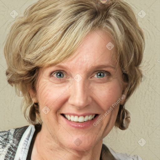 Joyful white adult female with medium  brown hair and blue eyes