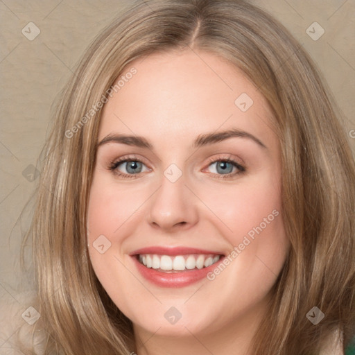 Joyful white young-adult female with long  brown hair and green eyes