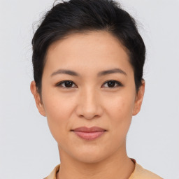 Joyful asian young-adult female with short  brown hair and brown eyes