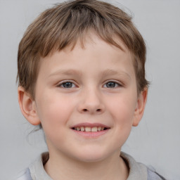 Joyful white child male with short  brown hair and brown eyes