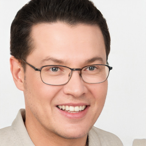 Joyful white young-adult male with short  brown hair and brown eyes