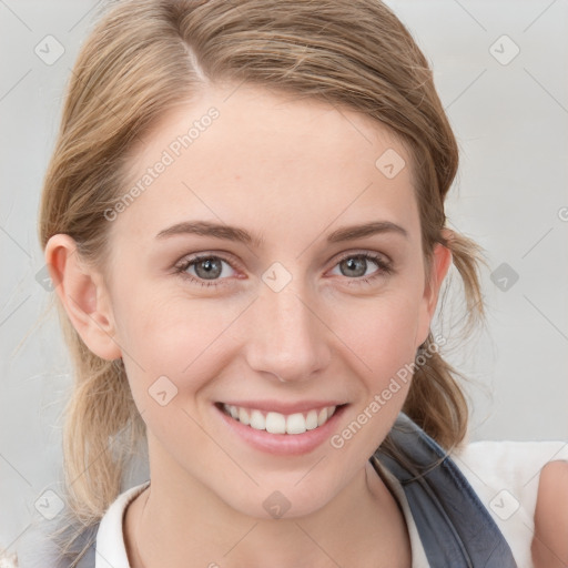 Joyful white young-adult female with medium  brown hair and blue eyes