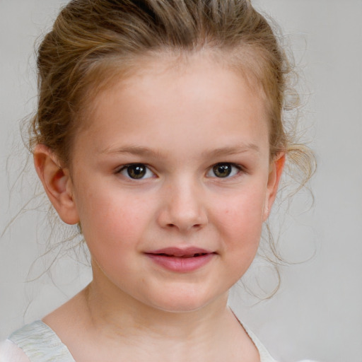 Joyful white child female with medium  brown hair and blue eyes