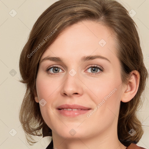 Joyful white young-adult female with medium  brown hair and green eyes