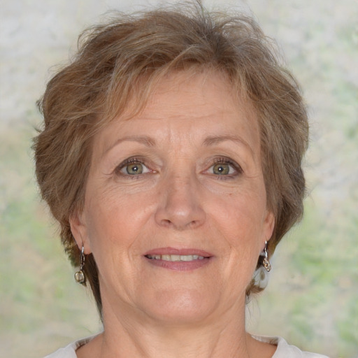 Joyful white middle-aged female with short  brown hair and brown eyes