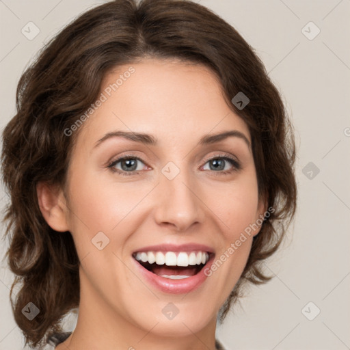 Joyful white young-adult female with medium  brown hair and green eyes