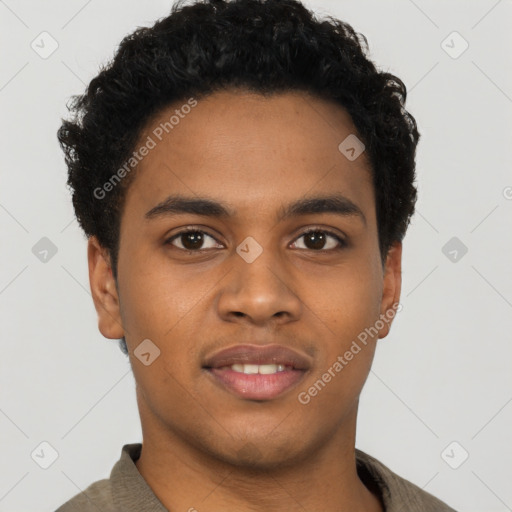 Joyful black young-adult male with short  brown hair and brown eyes