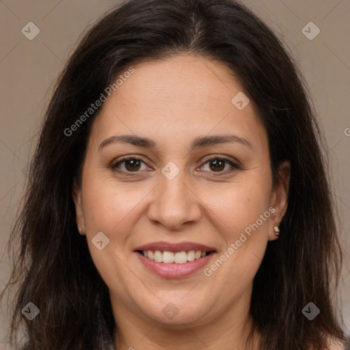 Joyful white adult female with long  brown hair and brown eyes