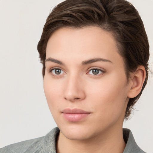 Neutral white young-adult female with short  brown hair and brown eyes