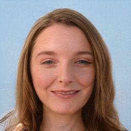 Joyful white young-adult female with long  brown hair and blue eyes