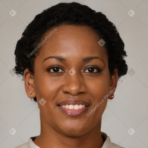 Joyful black young-adult female with short  brown hair and brown eyes