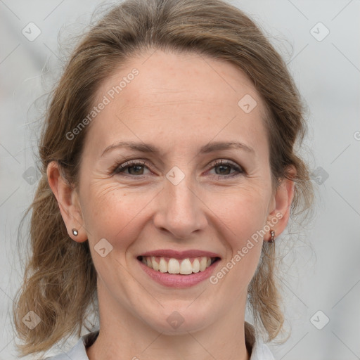 Joyful white adult female with medium  brown hair and grey eyes