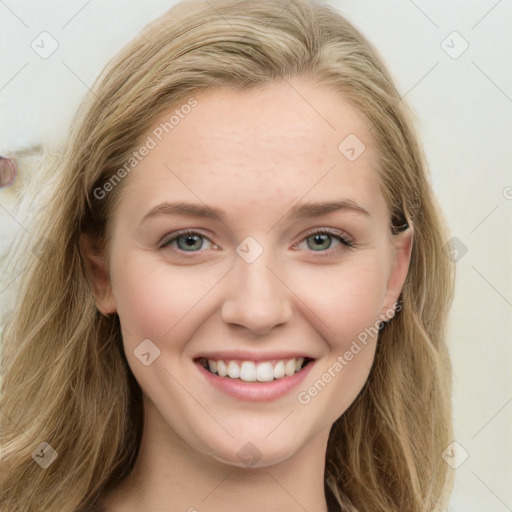 Joyful white young-adult female with long  brown hair and blue eyes