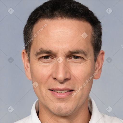 Joyful white adult male with short  brown hair and brown eyes