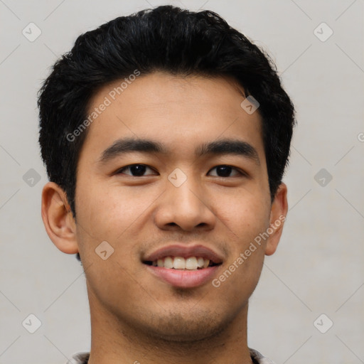 Joyful asian young-adult male with short  black hair and brown eyes