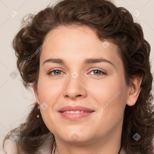 Joyful white young-adult female with medium  brown hair and green eyes