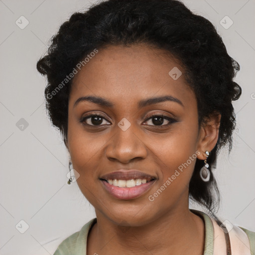 Joyful black young-adult female with long  black hair and brown eyes