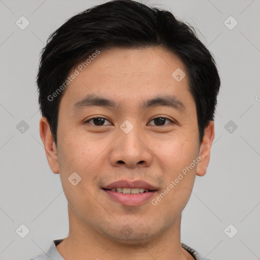 Joyful asian young-adult male with short  brown hair and brown eyes