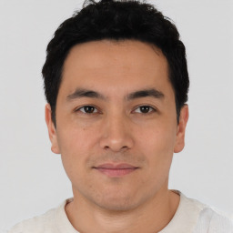 Joyful asian young-adult male with short  black hair and brown eyes