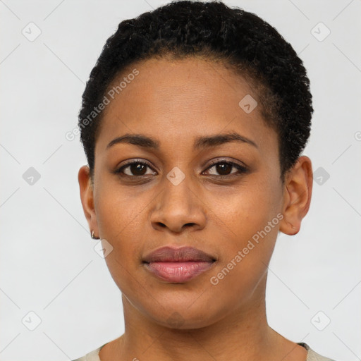 Joyful black young-adult female with short  black hair and brown eyes