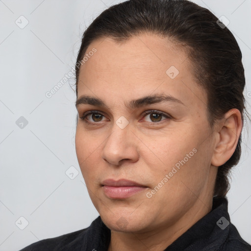 Joyful white adult female with medium  brown hair and brown eyes