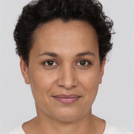Joyful white adult female with short  brown hair and brown eyes