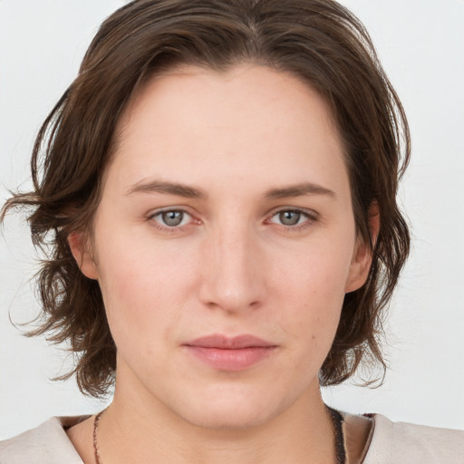 Neutral white young-adult female with medium  brown hair and grey eyes