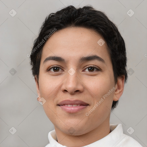 Joyful latino young-adult female with short  brown hair and brown eyes