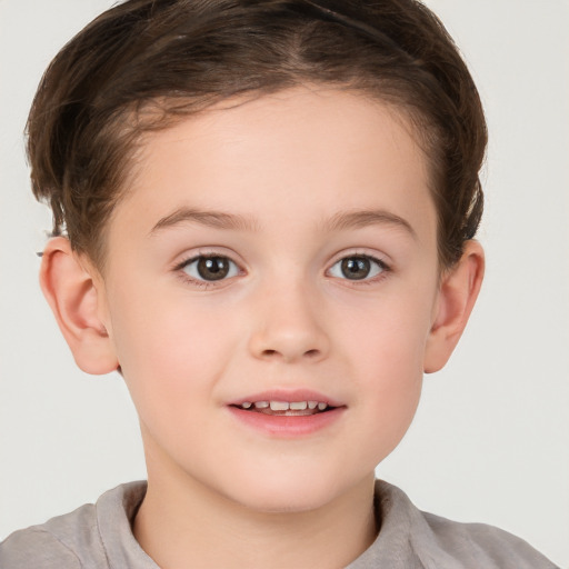 Joyful white child female with short  brown hair and brown eyes