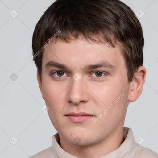 Neutral white young-adult male with short  brown hair and grey eyes