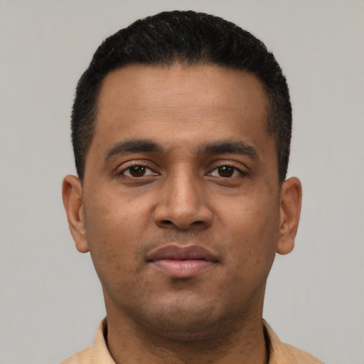 Neutral latino young-adult male with short  black hair and brown eyes