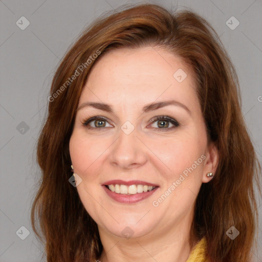 Joyful white adult female with medium  brown hair and brown eyes