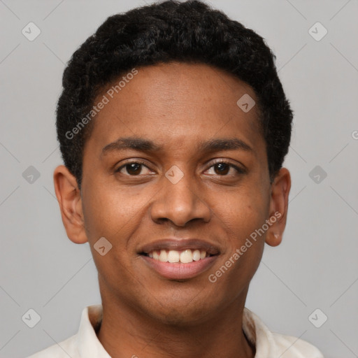 Joyful black young-adult male with short  brown hair and brown eyes