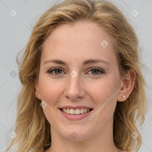 Joyful white young-adult female with medium  brown hair and blue eyes