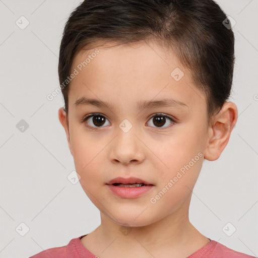 Joyful white child female with short  brown hair and brown eyes