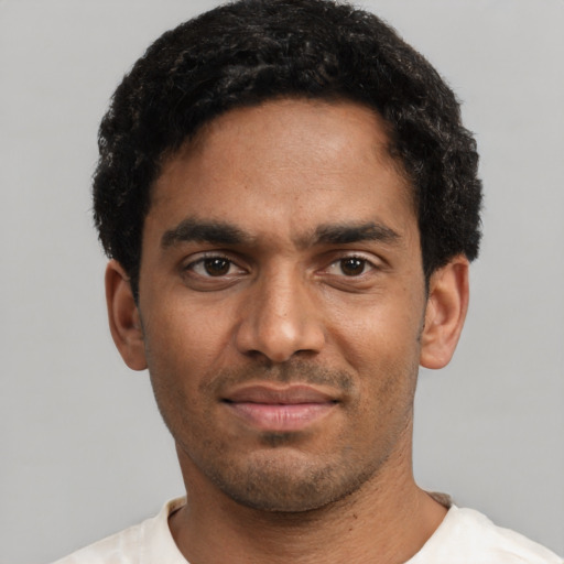 Neutral black young-adult male with short  black hair and brown eyes