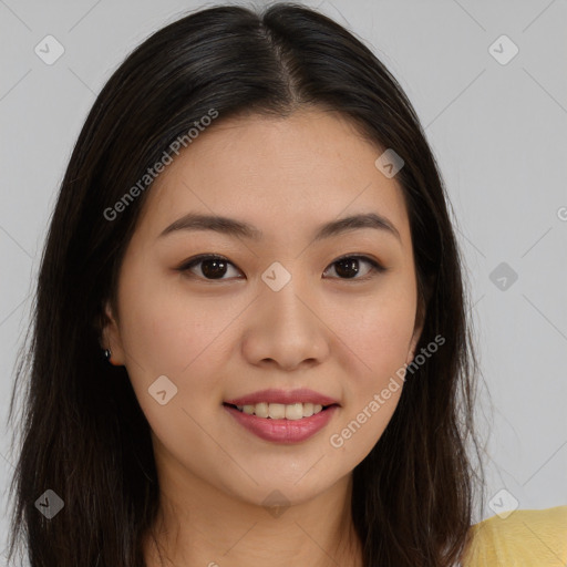 Joyful asian young-adult female with long  brown hair and brown eyes