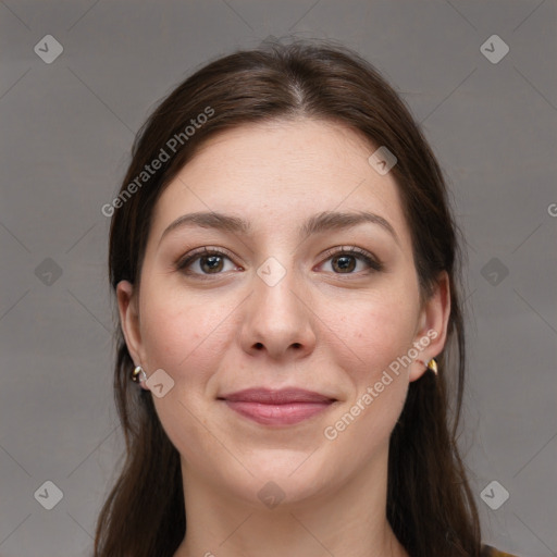 Joyful white young-adult female with long  brown hair and brown eyes