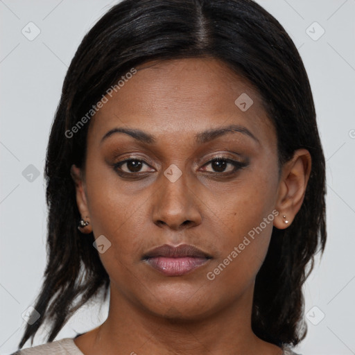 Joyful black young-adult female with medium  brown hair and brown eyes