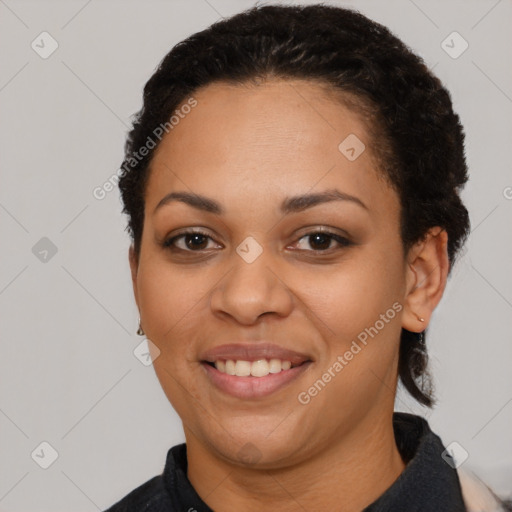 Joyful latino young-adult female with short  black hair and brown eyes