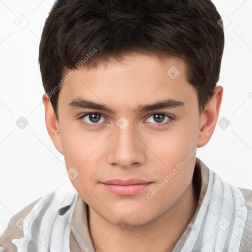 Joyful white child male with short  brown hair and brown eyes