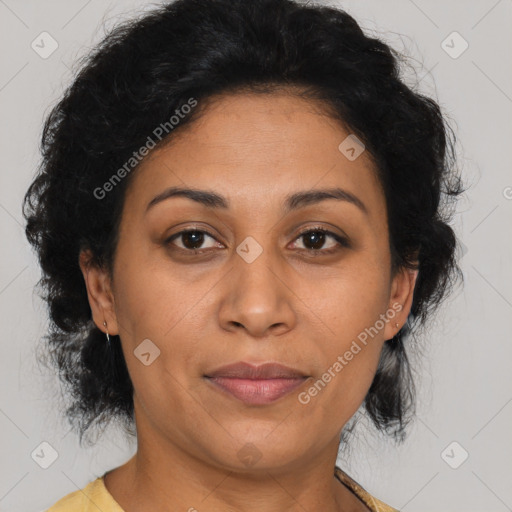 Joyful latino adult female with medium  brown hair and brown eyes