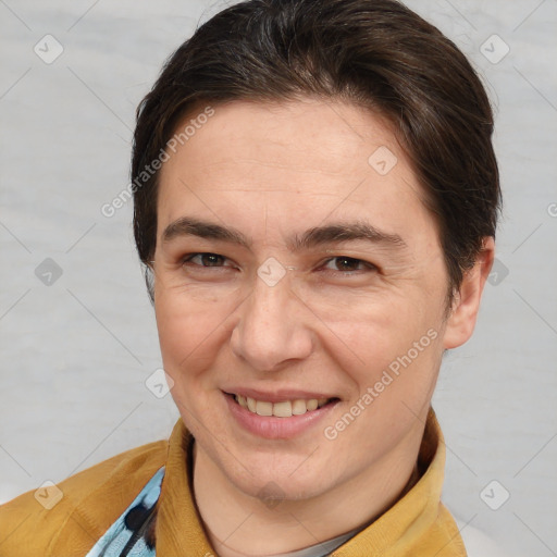 Joyful white adult female with short  brown hair and brown eyes