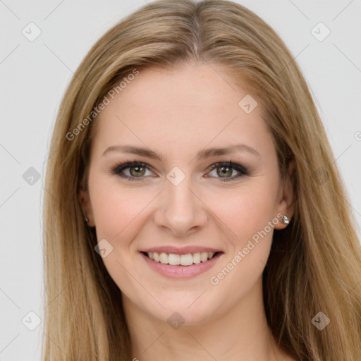 Joyful white young-adult female with long  brown hair and green eyes